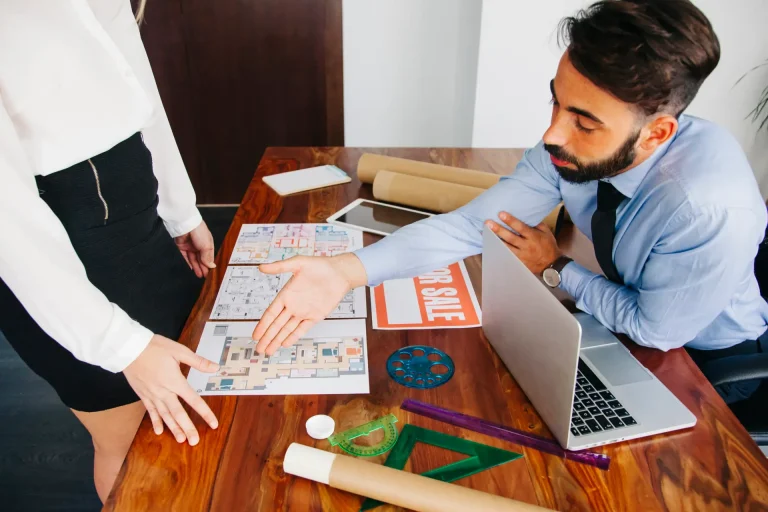 real-estate-businessman-reaching-out-hand