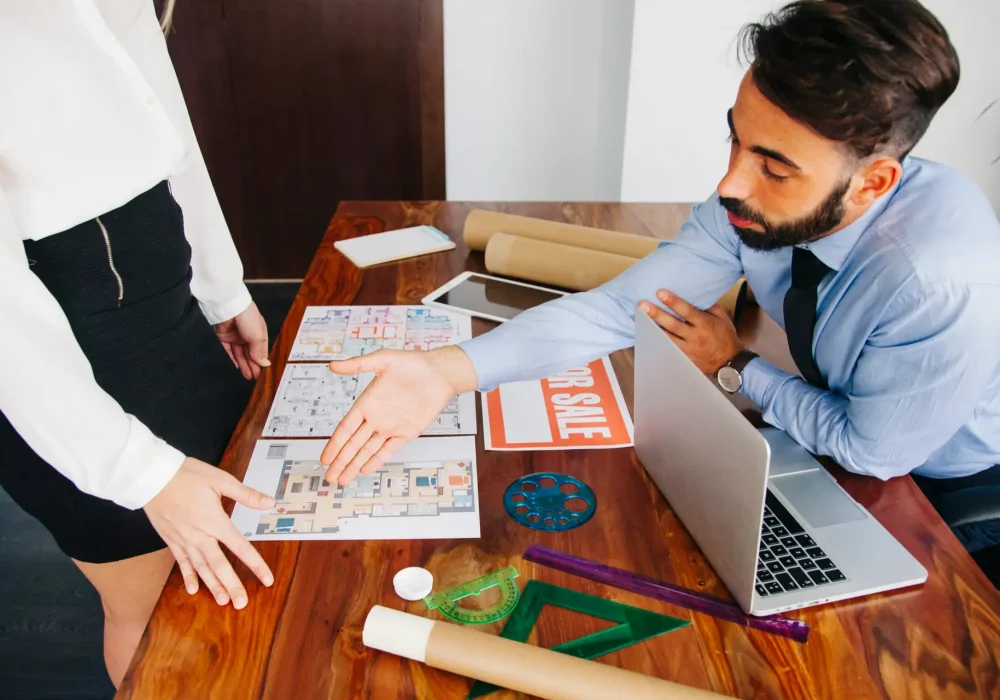 real-estate-businessman-reaching-out-hand